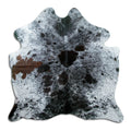 Salt and pepper cowhide rug of about 160 × 160 cm, seen from above: the exact hide you receive