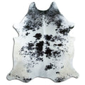 Salt and pepper cowhide rug of about 210 × 180 cm, seen from above: the exact hide you receive