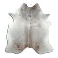 Tan and grey cowhide rug of about 190 × 180 cm, seen from above: the exact hide you receive
