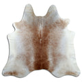 Tan and grey cowhide rug of about 190 × 200 cm, seen from above: the exact hide you receive