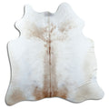 Tan and grey cowhide rug of about 170 × 170 cm, seen from above: the exact hide you receive