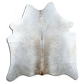 Tan and grey cowhide rug of about 170 × 160 cm, seen from above: the exact hide you receive