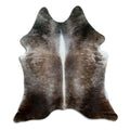 Tan and grey cowhide rug of about 180 × 160 cm, seen from above: the exact hide you receive
