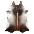 Tan and grey cowhide rug of about 230 × 180 cm, seen from above: the exact hide you receive