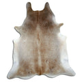 Tan and grey cowhide rug of about 230 × 200 cm, seen from above: the exact hide you receive