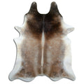 Tan and grey cowhide rug of about 230 × 190 cm, seen from above: the exact hide you receive