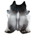 Tan and grey cowhide rug of about 240 × 190 cm, seen from above: the exact hide you receive