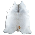 Tan and grey cowhide rug of about 230 × 190 cm, seen from above: the exact hide you receive