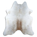 Tan and grey cowhide rug of about 210 × 190 cm, seen from above: the exact hide you receive