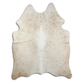 Brown cowhide rug of about 190 × 150 cm, seen from above: the exact hide you receive