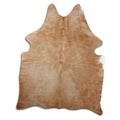Brown cowhide rug of about 180 × 150 cm, seen from above: the exact hide you receive