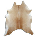 Brown cowhide rug of about 210 × 180 cm, seen from above: the exact hide you receive