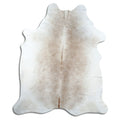 Brown cowhide rug of about 220 × 190 cm, seen from above: the exact hide you receive