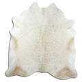 Brown cowhide rug of about 210 × 200 cm, seen from above: the exact hide you receive