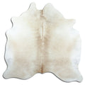 Brown cowhide rug of about 190 × 190 cm, seen from above: the exact hide you receive