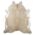 Brown cowhide rug of about 210 × 180 cm, seen from above: the exact hide you receive
