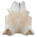 Brown cowhide rug of about 220 × 200 cm, seen from above: the exact hide you receive