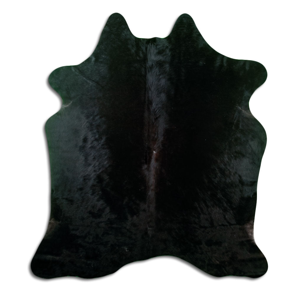 Black cowhide rug of about 190 × 160 cm, seen from above: the exact hide you receive