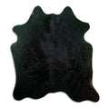 Black cowhide rug of about 180 × 160 cm, seen from above: the exact hide you receive