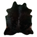 Black cowhide rug of about 190 × 170 cm, seen from above: the exact hide you receive