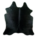 Black cowhide rug of about 180 × 170 cm, seen from above: the exact hide you receive