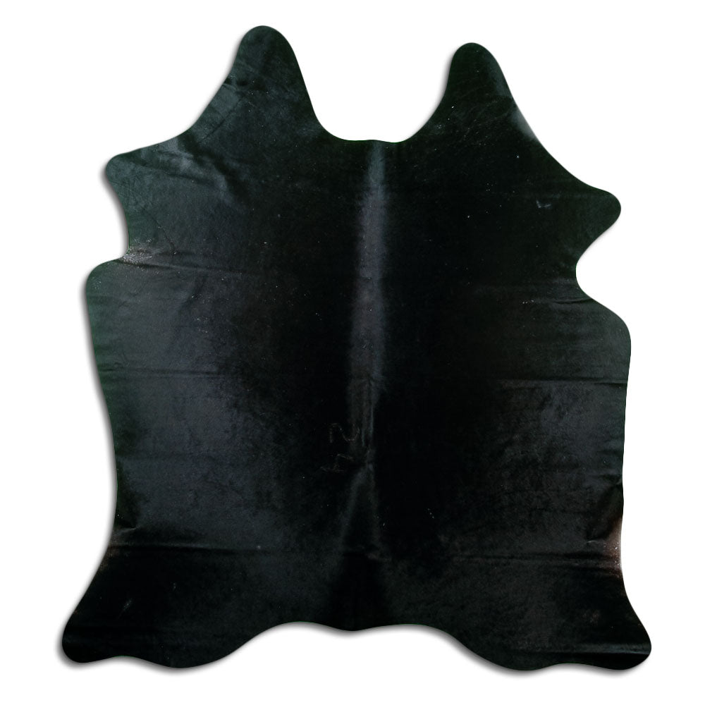 Black cowhide rug of about 180 × 170 cm, seen from above: the exact hide you receive