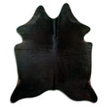Black cowhide rug of about 190 × 170 cm, seen from above: the exact hide you receive