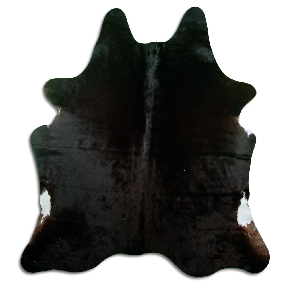 Black cowhide rug of about 180 × 160 cm, seen from above: the exact hide you receive