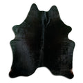 Black cowhide rug of about 180 × 160 cm, seen from above: the exact hide you receive