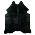 Black cowhide rug of about 190 × 160 cm, seen from above: the exact hide you receive