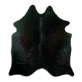 Black cowhide rug of about 180 × 160 cm, seen from above: the exact hide you receive