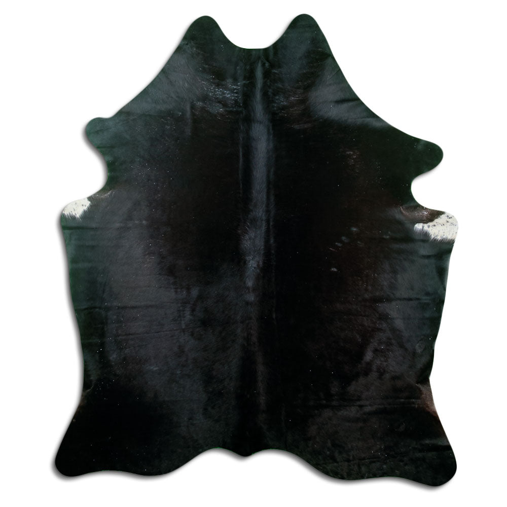 Black cowhide rug of about 190 × 160 cm, seen from above: the exact hide you receive