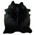 Black cowhide rug of about 220 × 190 cm, seen from above: the exact hide you receive