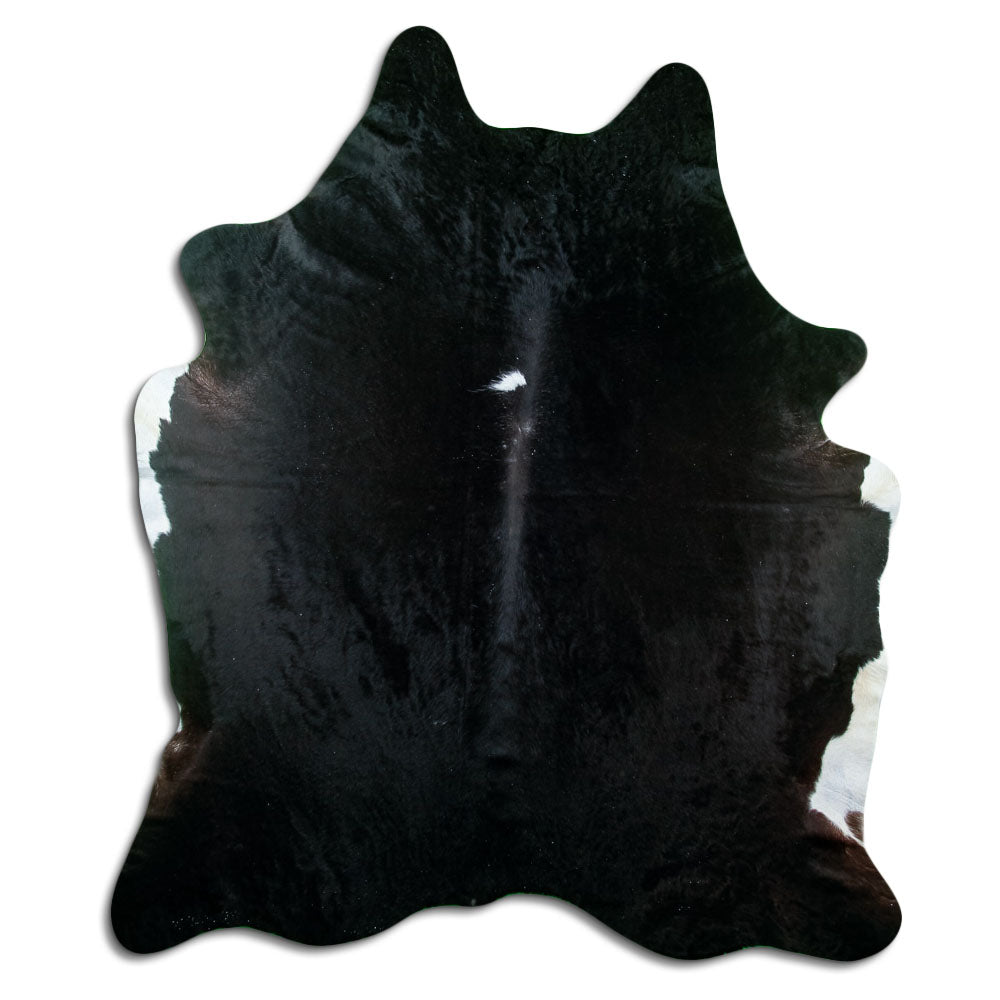 Black cowhide rug of about 220 × 190 cm, seen from above: the exact hide you receive