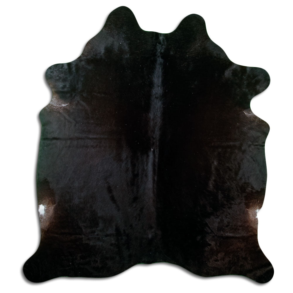 Black cowhide rug of about 200 × 180 cm, seen from above: the exact hide you receive