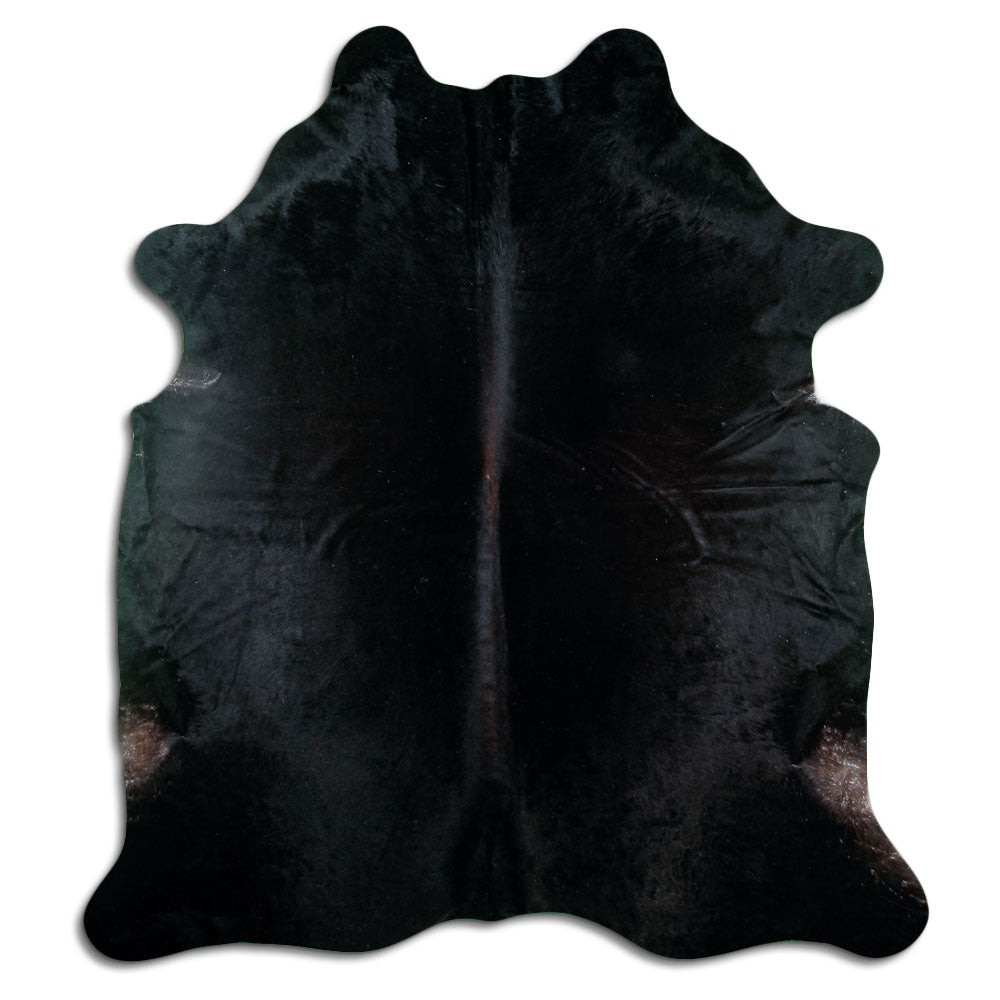 Black cowhide rug of about 220 × 200 cm, seen from above: the exact hide you receive