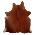 Brown cowhide rug of about 180 × 160 cm, seen from above: the exact hide you receive