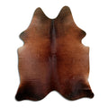 Brown cowhide rug of about 200 × 160 cm, seen from above: the exact hide you receive