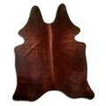 Brown cowhide rug of about 180 × 150 cm, seen from above: the exact hide you receive