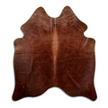 Brown cowhide rug of about 170 × 150 cm, seen from above: the exact hide you receive