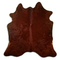Brown cowhide rug of about 180 × 180 cm, seen from above: the exact hide you receive