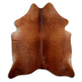 Brown cowhide rug of about 190 × 160 cm, seen from above: the exact hide you receive