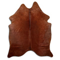 Brown cowhide rug of about 190 × 150 cm, seen from above: the exact hide you receive