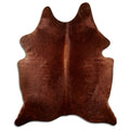 Brown cowhide rug of about 200 × 170 cm, seen from above: the exact hide you receive