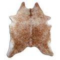 Brown cowhide rug of about 230 × 190 cm, seen from above: the exact hide you receive