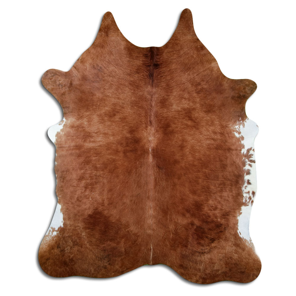 Brown cowhide rug of about 220 × 180 cm, seen from above: the exact hide you receive