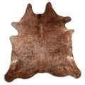 Brown cowhide rug of about 230 × 220 cm, seen from above: the exact hide you receive