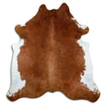 Brown cowhide rug of about 210 × 200 cm, seen from above: the exact hide you receive