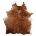 Brown cowhide rug of about 200 × 160 cm, seen from above: the exact hide you receive