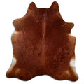 Brown cowhide rug of about 220 × 200 cm, seen from above: the exact hide you receive